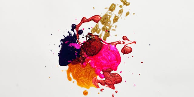 Colorful abstract paint splash on white background, capturing creative expression.