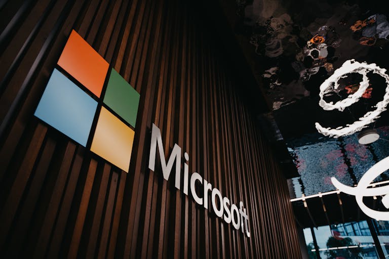 Interior view of Microsoft office with logo on wooden wall in Brussels, Belgium.